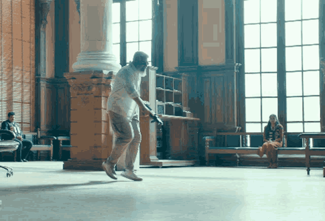 a man is jumping in the air while holding a sword