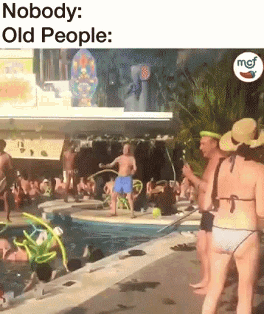 a group of people are standing around a swimming pool with the caption nobody : old people