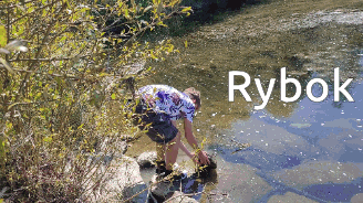 a person is bending over in a river and the word rybok is on the bottom