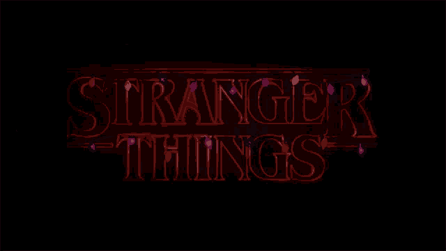 a neon sign that says stranger things with christmas lights behind it