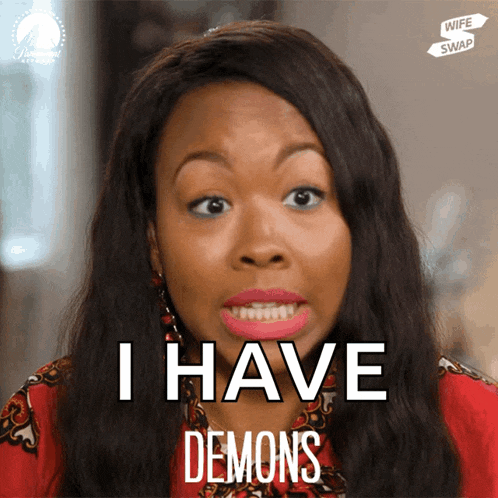 a woman says i have demons in front of a wife swap sign