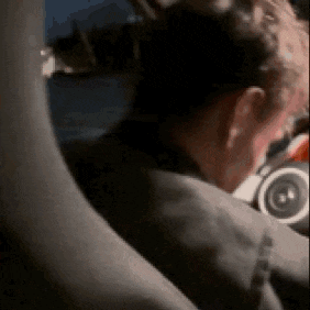 a close up of a man 's neck and shoulder while wearing headphones .