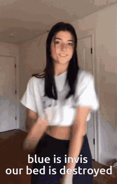 a girl is dancing in a room with the words " blue is invis our bed is destroyed "