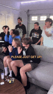 a group of people are sitting on a couch with the words please just get up on the bottom