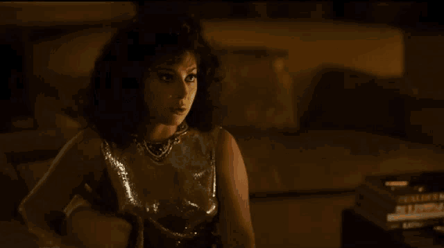 a woman says it 's time to take out the trash in a dark room