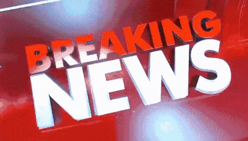 a red sign that says breaking news in white letters
