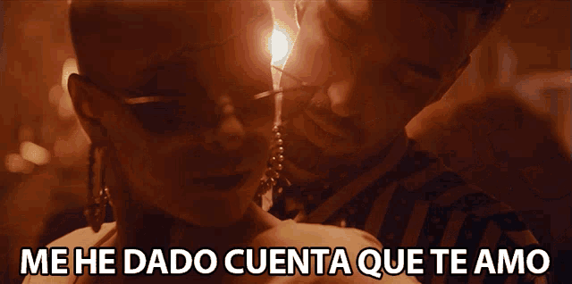 a man and a woman are standing next to each other with me he dado cuenta que te amo written below them