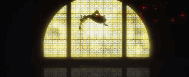 a stained glass window with a person laying on it