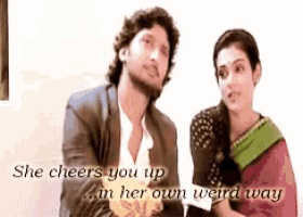 a man and a woman are sitting next to each other with the words she cheers you up in her own weird way
