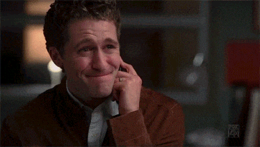 a man is laughing while talking on a cell phone with the fox logo in the corner