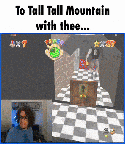 a man playing a video game with the caption to tall tall mountain with thee ...