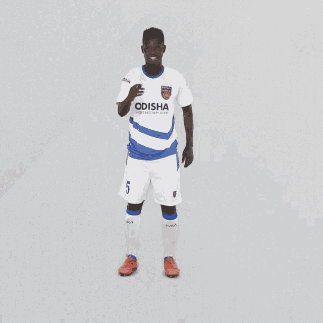 a soccer player wearing a dasa jersey with the number 5 on it