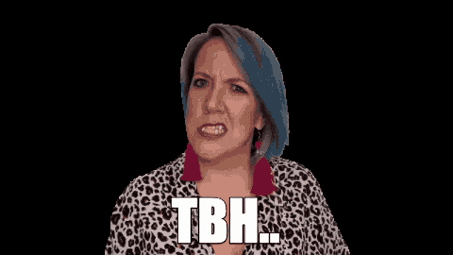 a woman with blue hair and a leopard print shirt is making a funny face and saying tbh