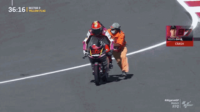 a man wearing a face mask is running towards a motorcycle racer