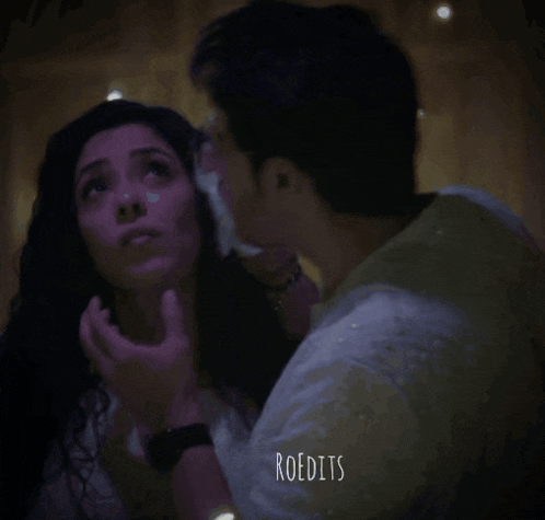 a man kissing a woman on the cheek with the word roedits visible in the corner