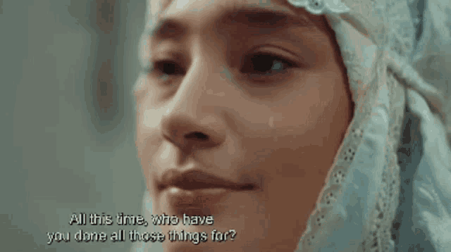 a close up of a woman 's face with a caption that says all this time who have you done all those things for