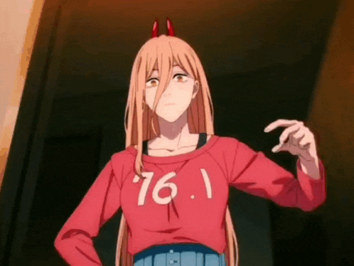 a girl with long blonde hair and horns is wearing a red sweater with the number .