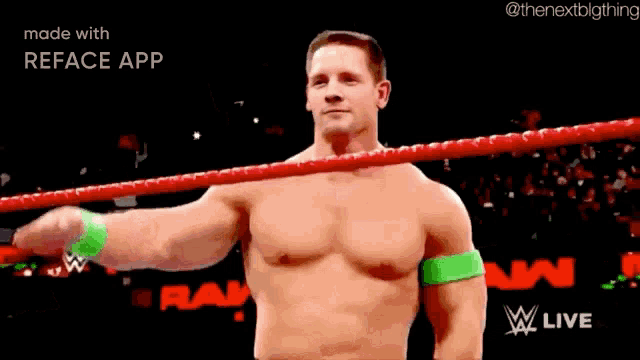a shirtless wrestling wrestler is saluting in a ring .