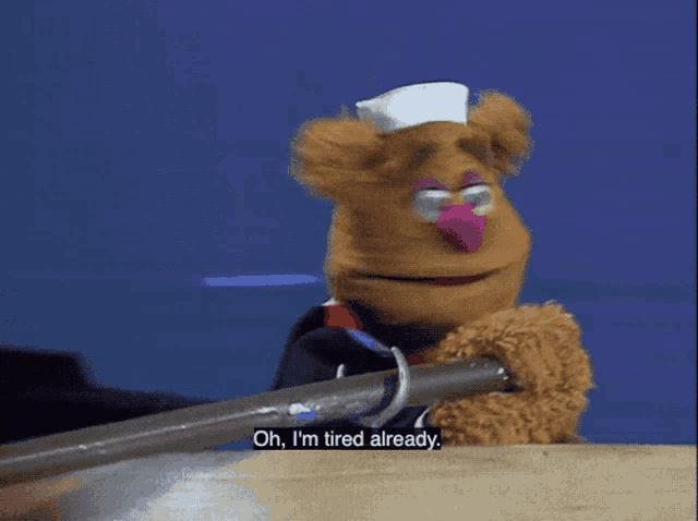 a teddy bear says oh i 'm tired already while sitting on a boat