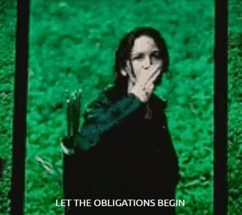 a woman is covering her mouth with her hand and the words let the obligations begin are below her