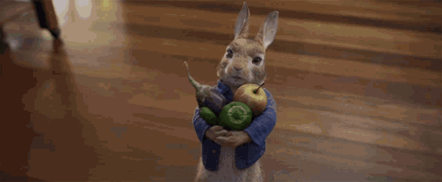 a stuffed animal is holding a bunch of fruit and vegetables
