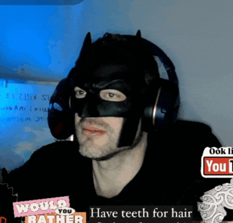 a man wearing a batman mask and headphones with a youtube logo in the background