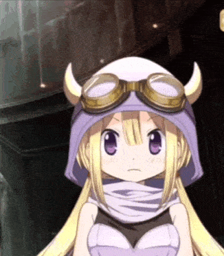 a girl with horns and goggles on her head