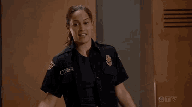 a woman in a firefighter uniform with the name le donne on her chest