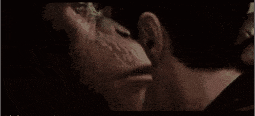 a close up of a man with a beard looking up