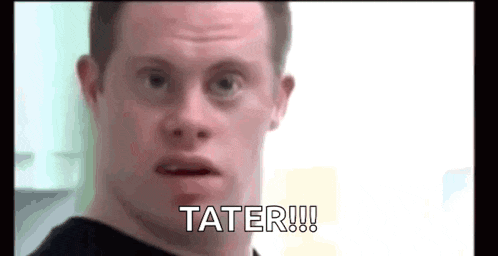 a man with down syndrome is making a funny face and says tater !!!