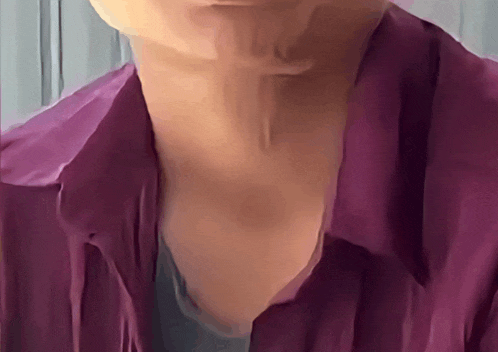 a close up of a person 's neck and chest