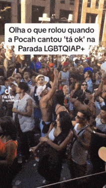 a crowd of people are gathered at a parada lgbtqiap +