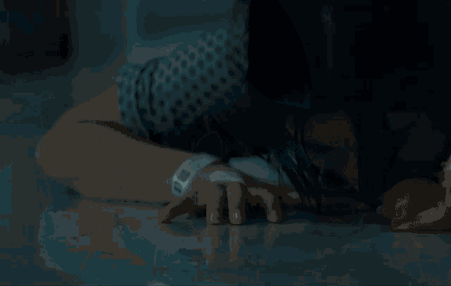 a close up of a woman 's face smiling in the dark