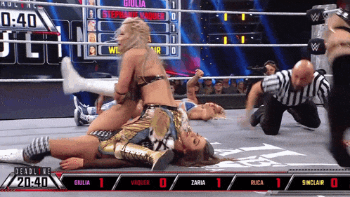 a wrestling match between giulia and zaria with a score of 1 to 0