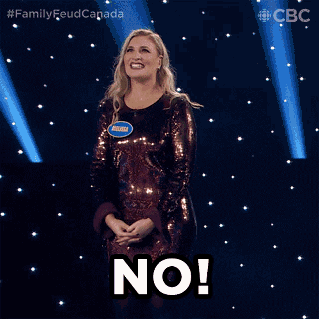 a woman in a sequined dress has the word no on her face