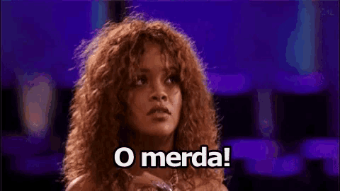 a woman with curly hair is standing in front of a purple background and says o merda .