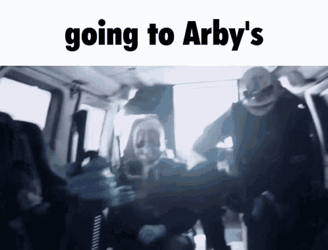 a group of people in masks are going to arby 's ..
