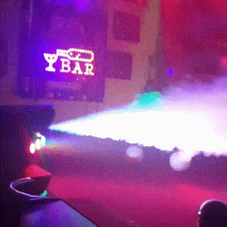a stage with a sign that says y bar