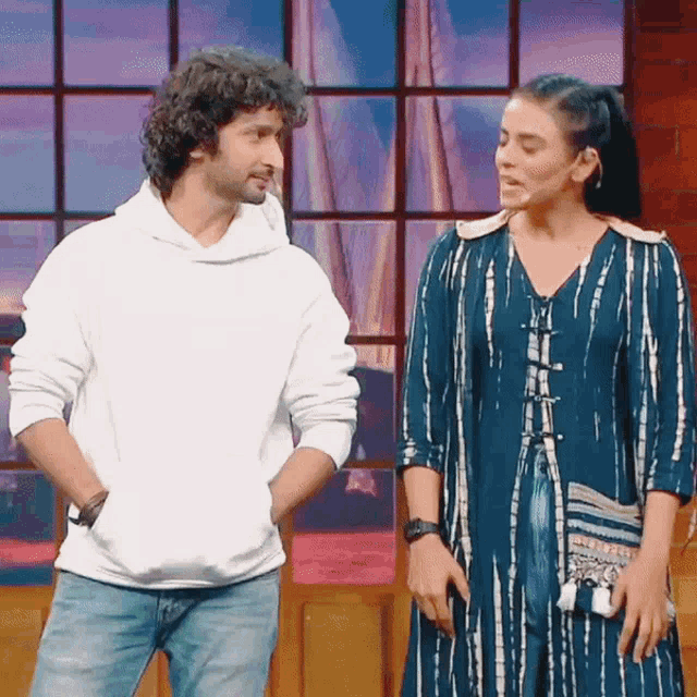 a man and a woman standing next to each other
