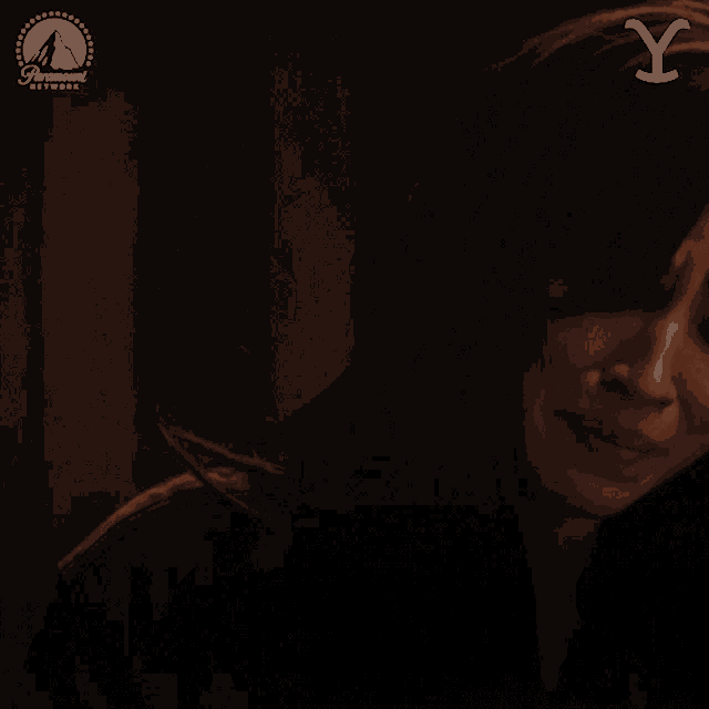 a woman 's face is shown with a paramount network logo behind her