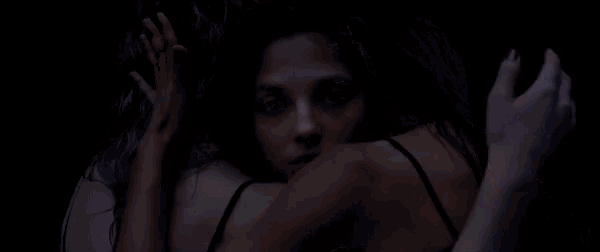 two women with purple hair are hugging each other