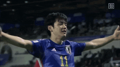 a soccer player wearing a number 11 jersey is crying