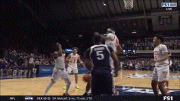 a basketball game is being played on fs1 live