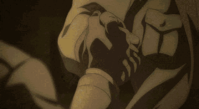 a close up of a person holding another person 's hands