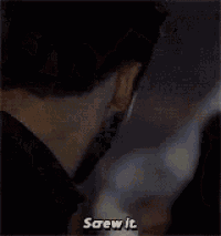 a man with a beard is looking down at something and saying `` screw it '' .