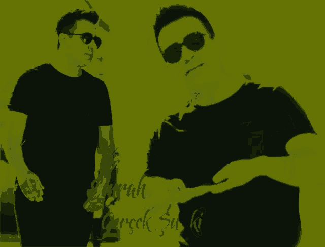 a man wearing sunglasses and a black shirt with the word emrah written on the bottom