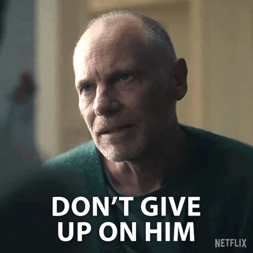 a man in a green sweater says don 't give up on him