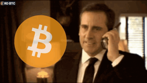 a man in a suit and tie is talking on a cell phone in front of a bitcoin icon