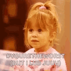 a little girl is making a funny face and saying `` youre the worst but i lub juju '' .