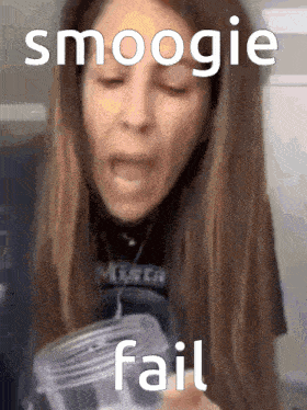 a woman making a funny face while holding a jar that says smoogie fail